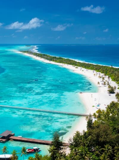 Aerial view of the 2km beach running the length of Atmosphere Kanifushi