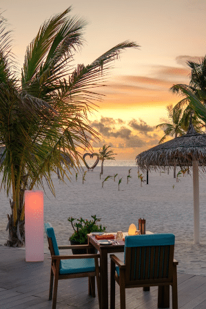 Sunset Grill beachfront dining at Brennia Kottefaru