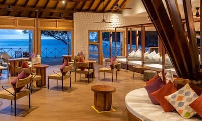 Raiyvilla sunset bar at dusk on Cinnamon Dhonveli island