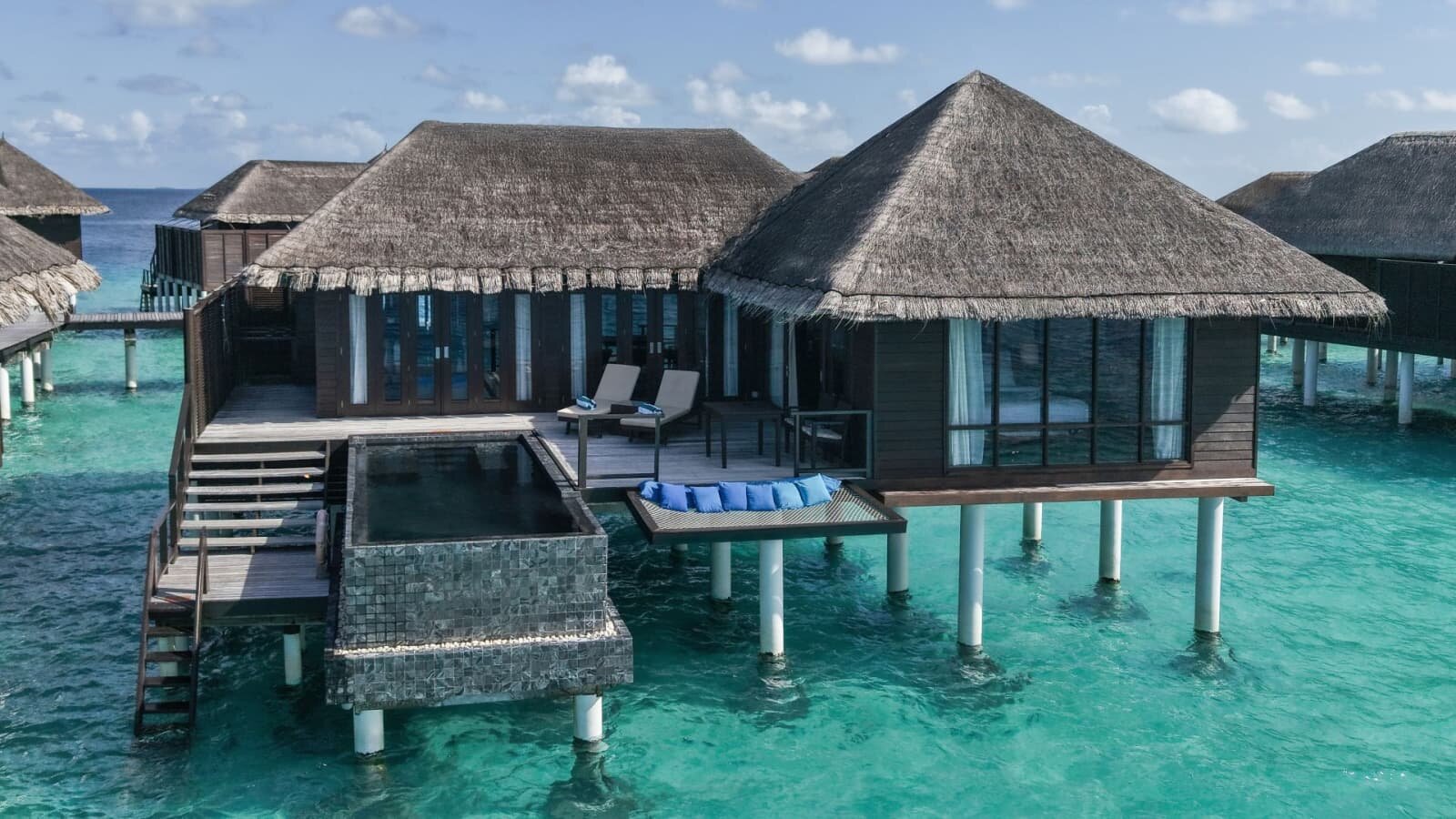 Escape Water Villa with Pool at Coco Bodu Hithi set further out over the water