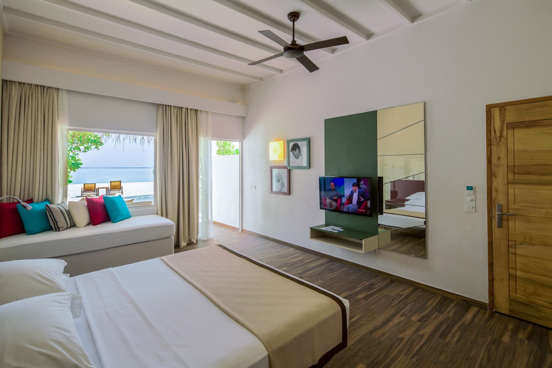 Beach Villa at Cocoon Maldives with terrace opening onto the sand